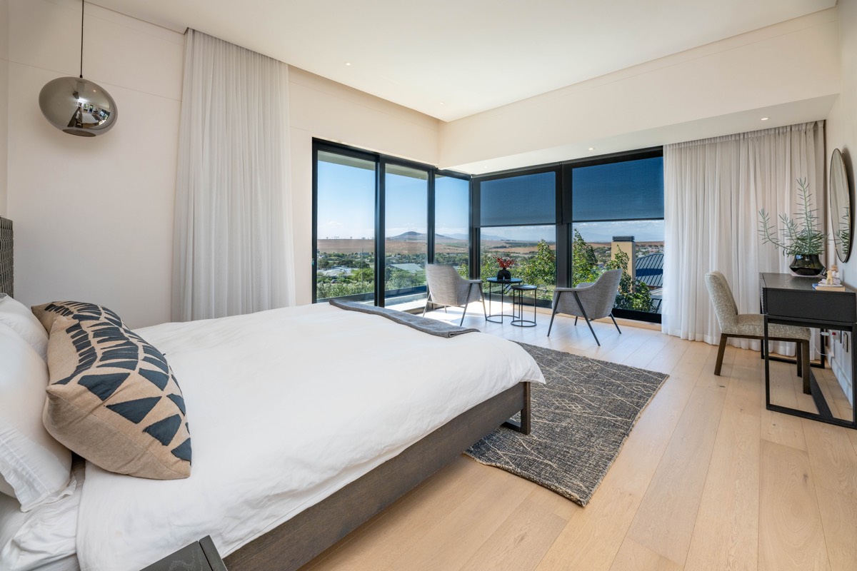 Blinds and sheer curtains in a modern Cape Town bedroom
