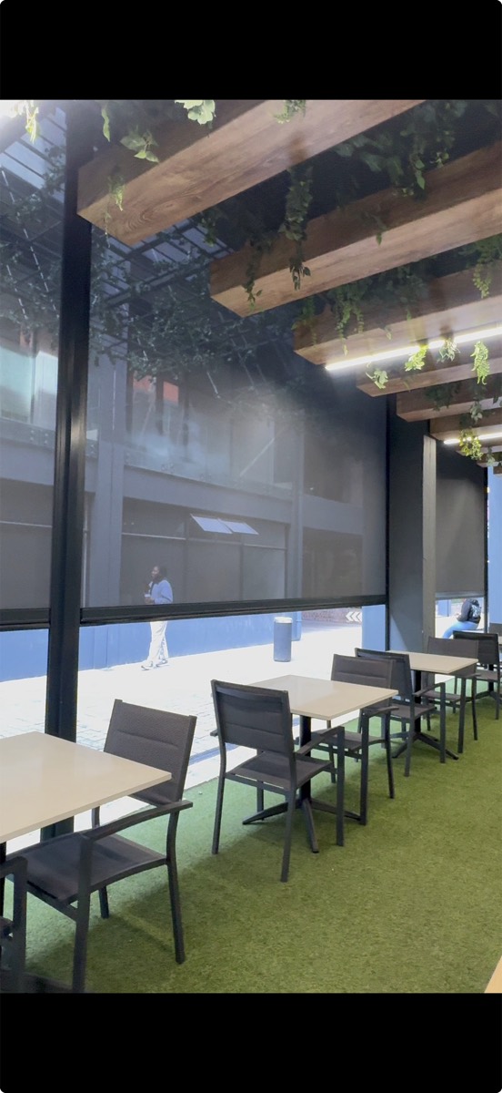 Outdoor screen blinds on a covered patio